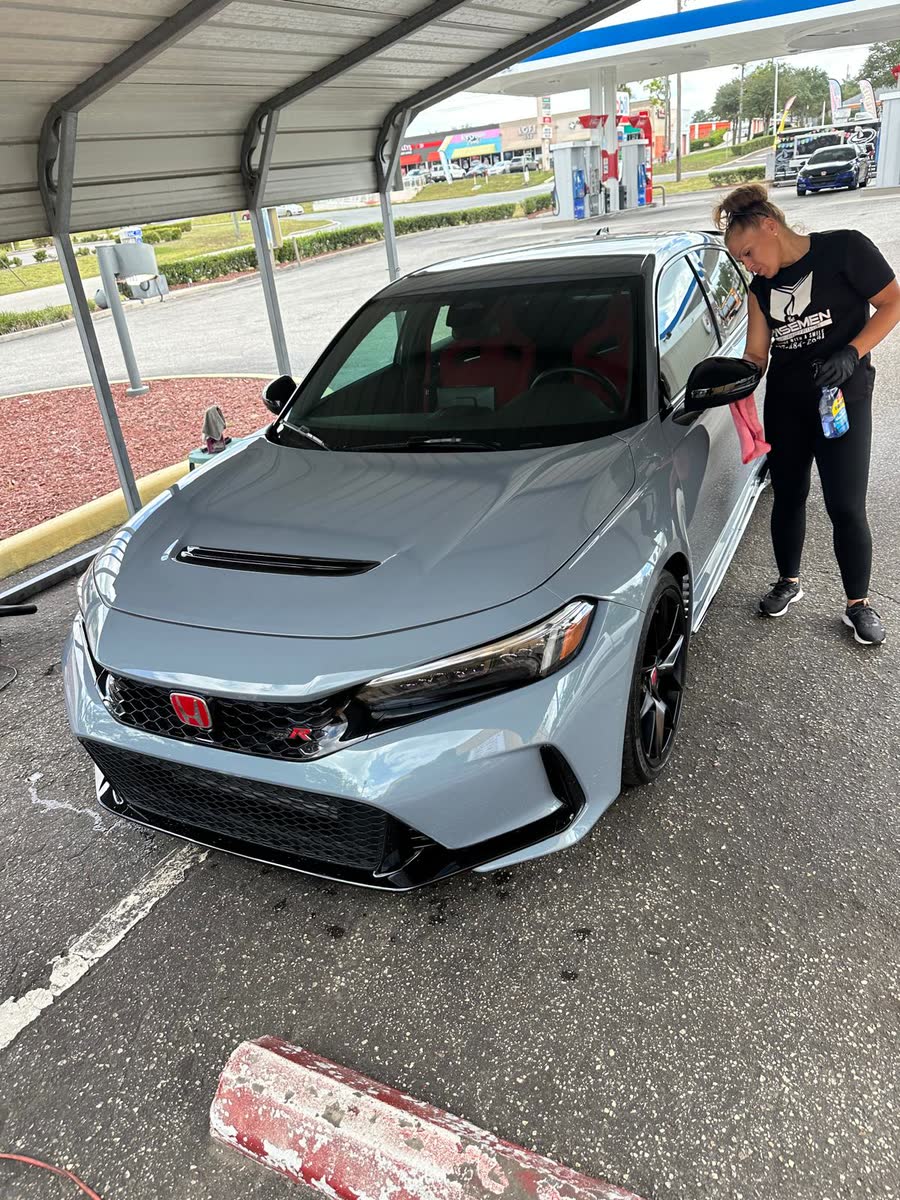 Gray Honda Civic Type R being finished under the Wisemen carport